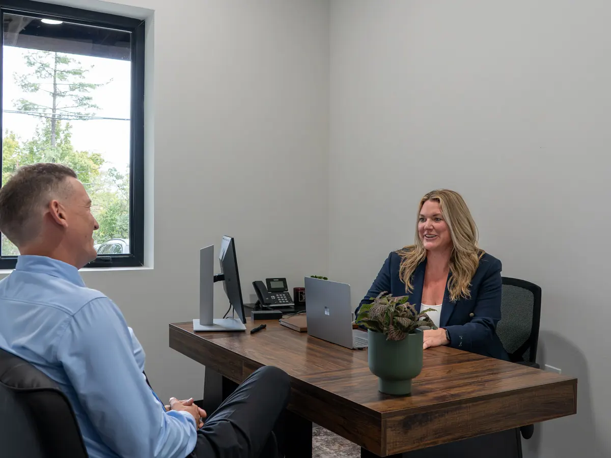 Amanda Gambrell, Cohen Mortgage loan officer, meeting with a client in her office